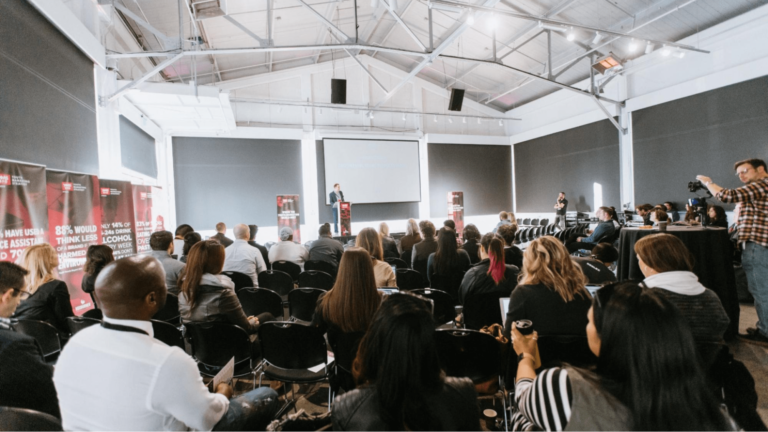 Conference attendees listening to speaker