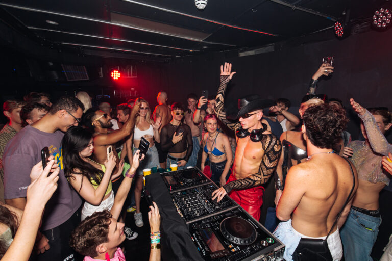 Partygoers dance at a Poof Doof event