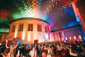 Eventgoers party at a silent disco event at the British Museum