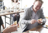 Attendee enjoys a cheese education class at Murray's Cheese in NYC.